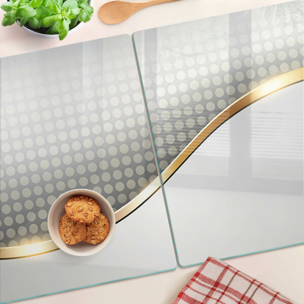Glass chopping board A golden wave on a background of dots