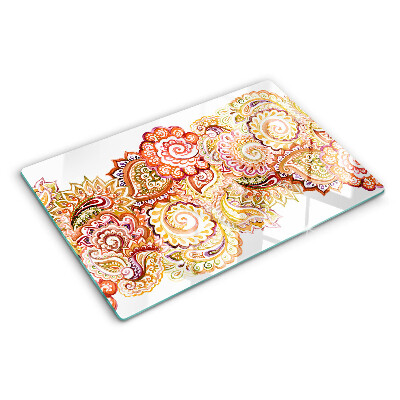 Chopping board glass Paisley motif in shades of red and gold
