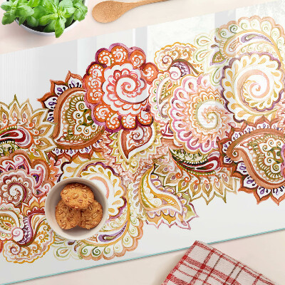 Chopping board glass Paisley motif in shades of red and gold