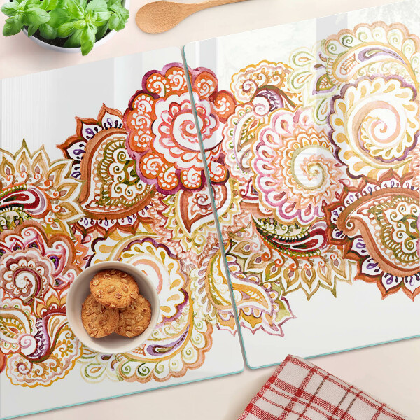 Chopping board glass Paisley motif in shades of red and gold