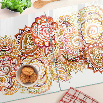 Chopping board glass Paisley motif in shades of red and gold
