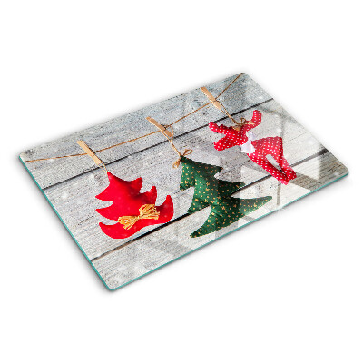 Cutting board Christmas decorations on a wooden background