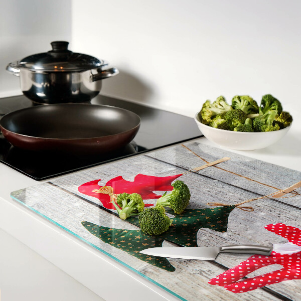 Cutting board Christmas decorations on a wooden background