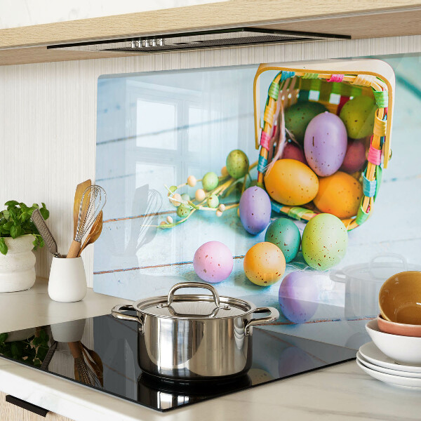 Glass chopping board Easter colored eggs in a basket