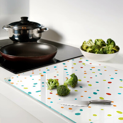 Chopping board glass Colorful dots on a white background