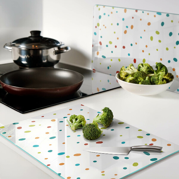 Chopping board glass Colorful dots on a white background