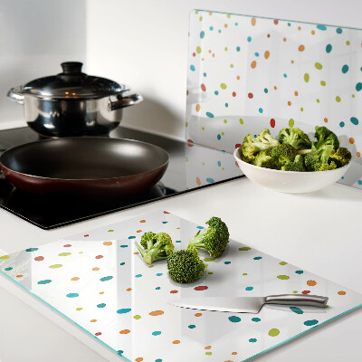 Chopping board glass Colorful dots on a white background