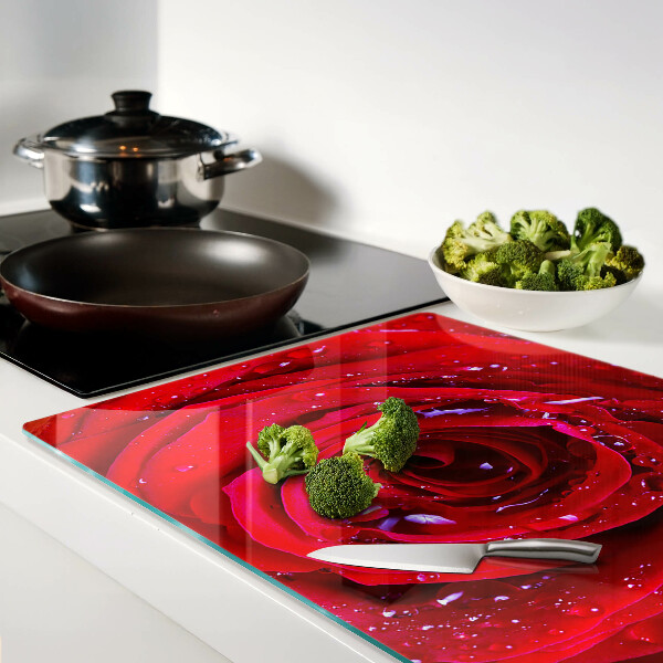 Glass kitchen board Red rose with water drops