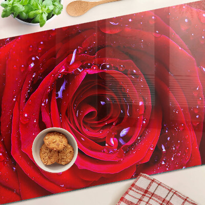 Glass kitchen board Red rose with water drops