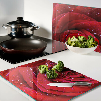 Glass kitchen board Red rose with water drops