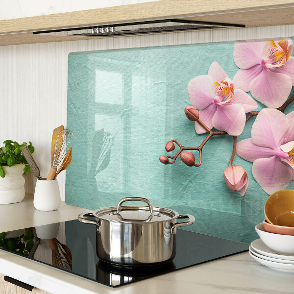 Glass cutting board Orchids on a blue background