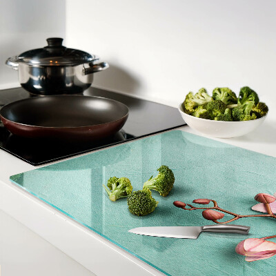 Glass cutting board Orchids on a blue background