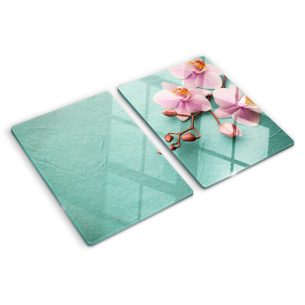 Glass cutting board Orchids on a blue background
