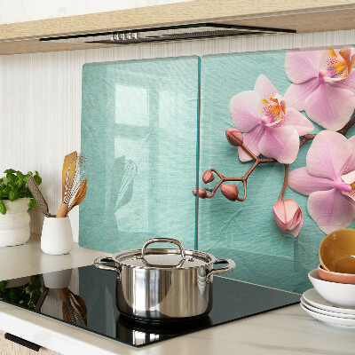 Glass cutting board Orchids on a blue background