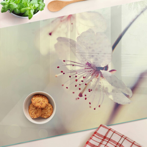 Glass kitchen board Flowers on a geometric background