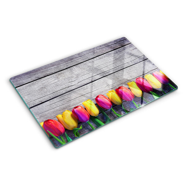 Chopping board Tulips on a wooden background