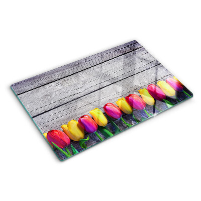 Chopping board Tulips on a wooden background