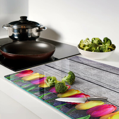 Chopping board Tulips on a wooden background
