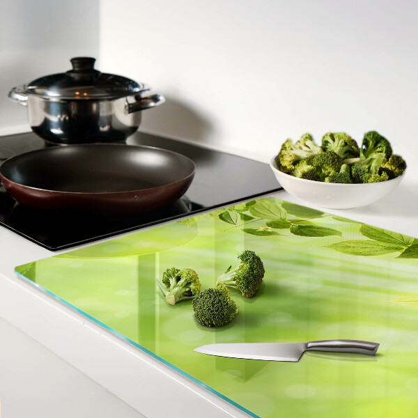 Glass chopping board Green leaves against the light