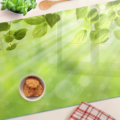 Glass chopping board Green leaves against the light