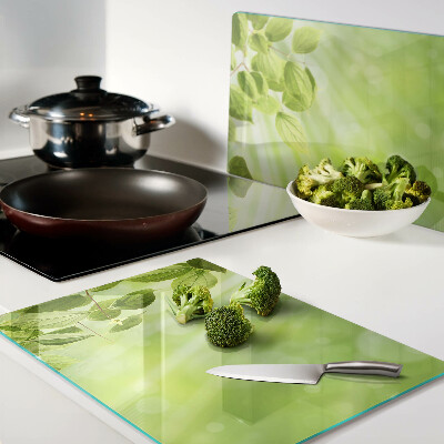 Glass chopping board Green leaves against the light