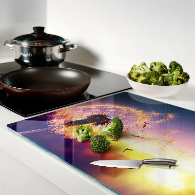 Chopping board Dandelions against the sunset background