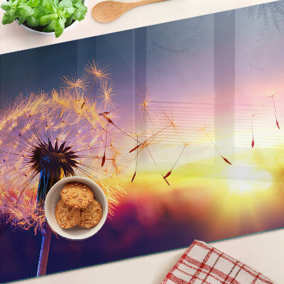 Chopping board Dandelions against the sunset background