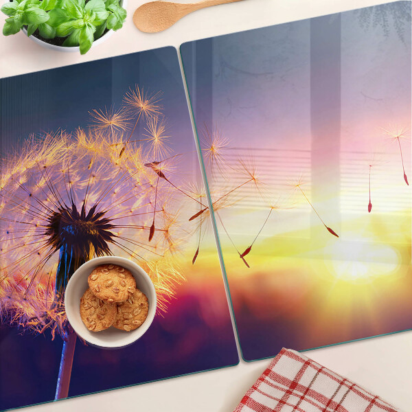 Chopping board Dandelions against the sunset background