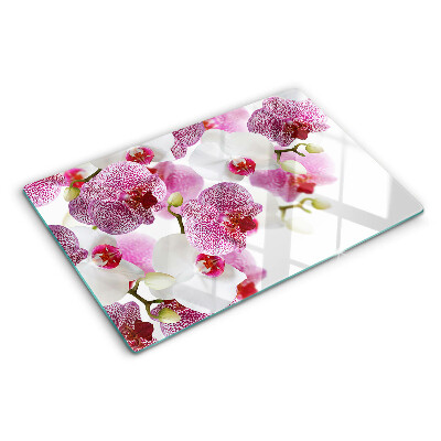 Chopping board glass Orchids in the background of the window
