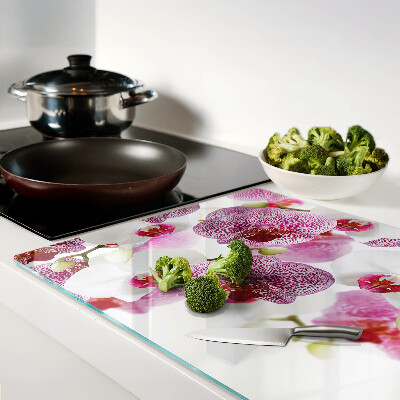 Chopping board glass Orchids in the background of the window