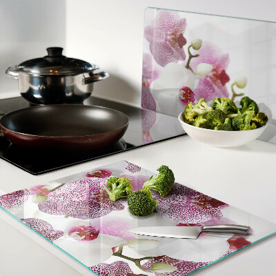 Chopping board glass Orchids in the background of the window