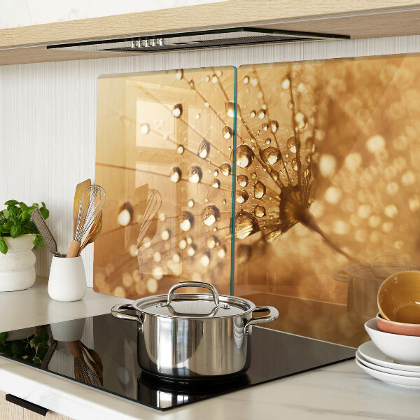 Glass cutting board Water drops on a dandelion