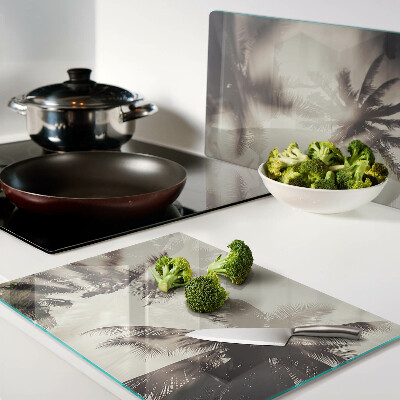 Glass kitchen board Palm trees on a monochrome background