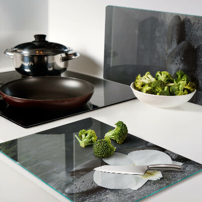 Glass kitchen board Orchid flower on stones