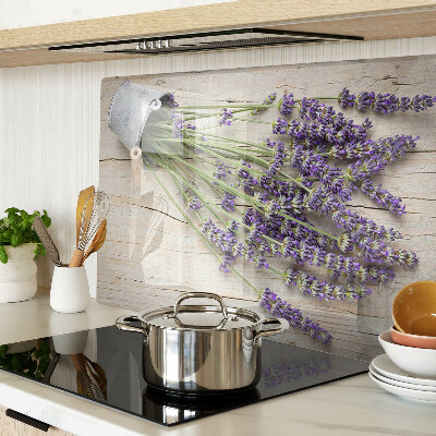 Chopping board glass Lavender in a pot on a wooden background