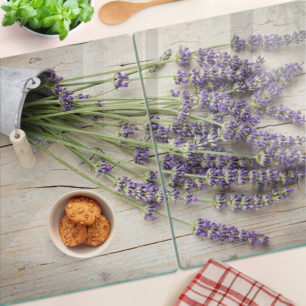 Chopping board glass Lavender in a pot on a wooden background