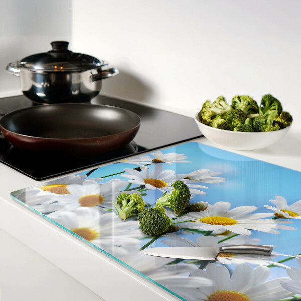 Glass chopping board Daisy flowers on a blue background