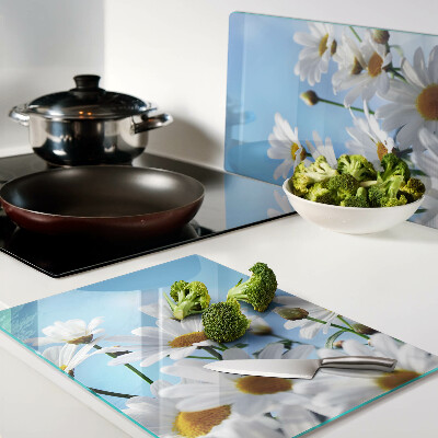 Glass chopping board Daisy flowers on a blue background