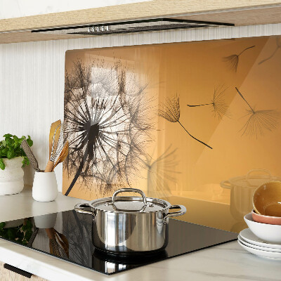 Glass chopping board Dandelions against the sunset background