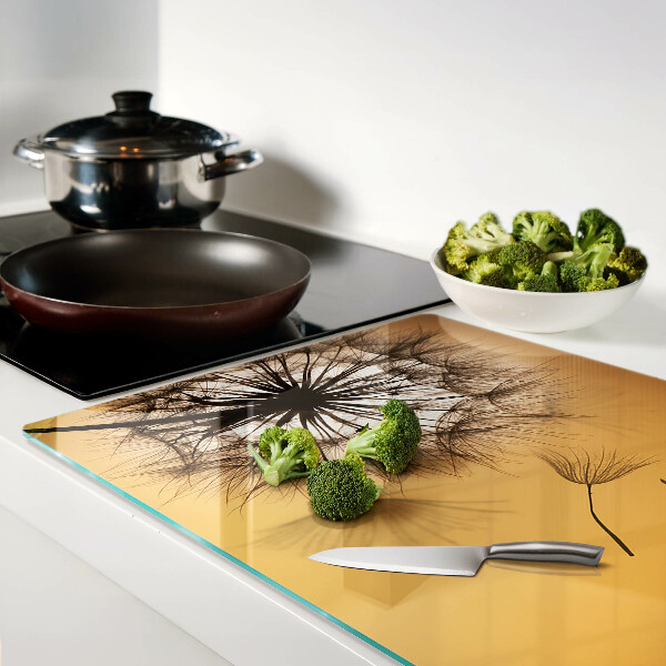 Glass chopping board Dandelions against the sunset background