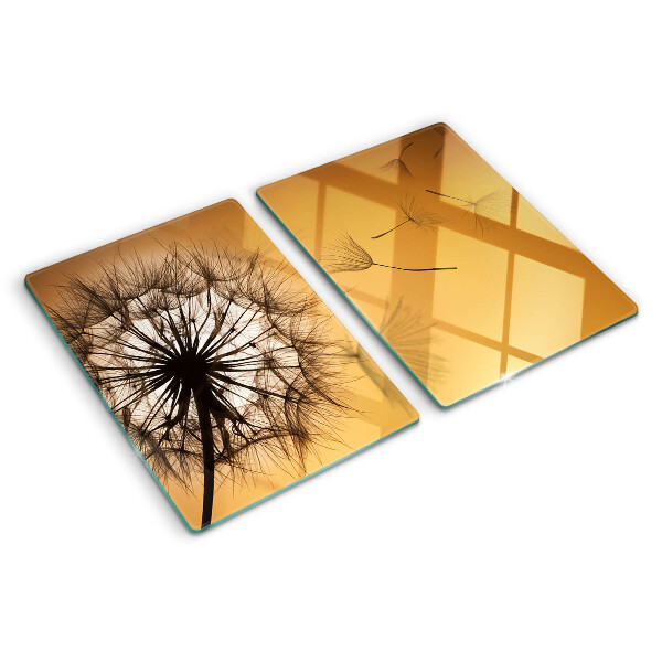 Glass chopping board Dandelions against the sunset background