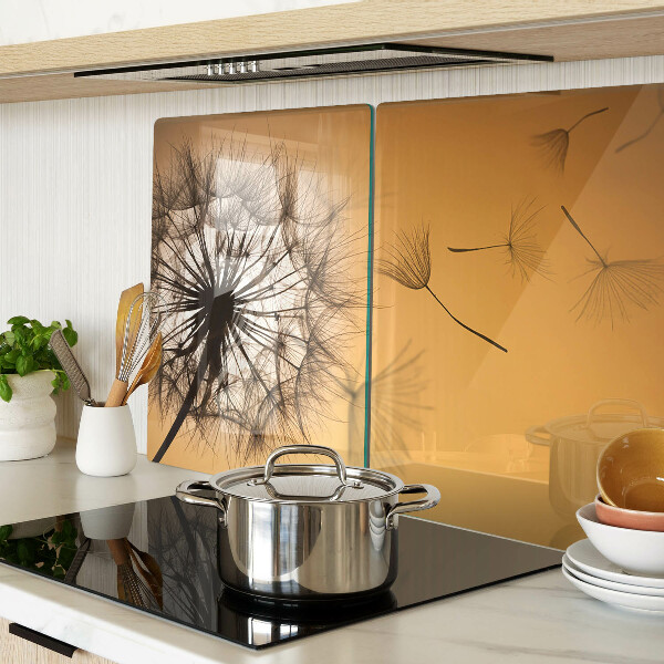 Glass chopping board Dandelions against the sunset background