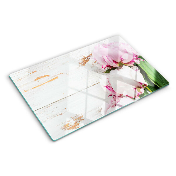 Glass cutting board Peony flowers on a wood background