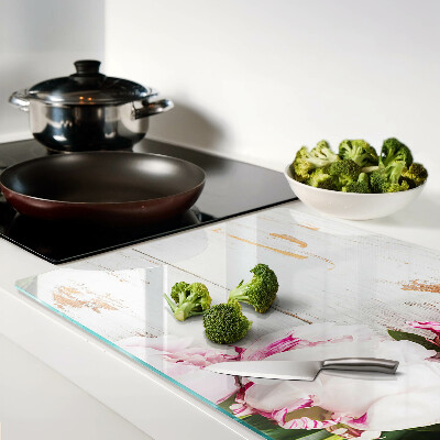 Glass cutting board Peony flowers on a wood background
