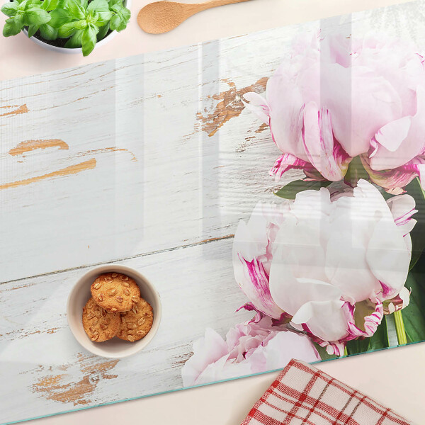 Glass cutting board Peony flowers on a wood background