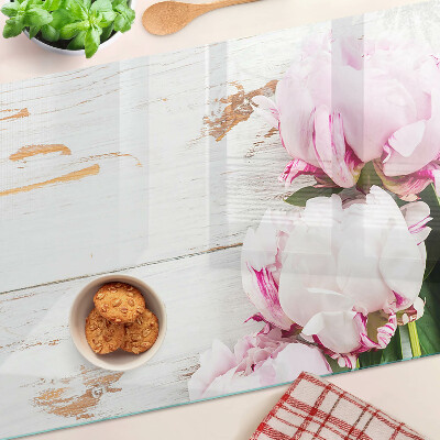 Glass cutting board Peony flowers on a wood background