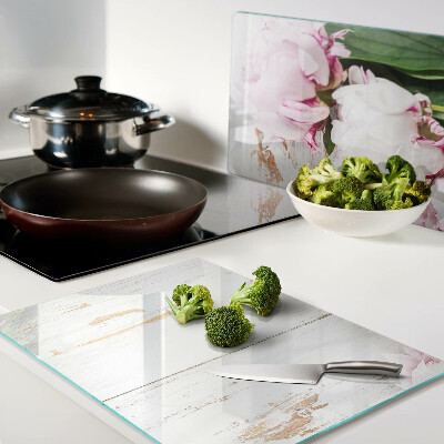 Glass cutting board Peony flowers on a wood background
