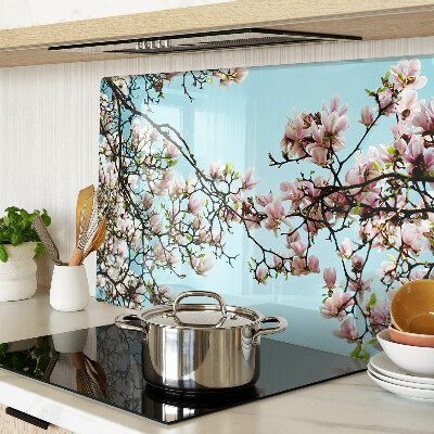Glass cutting board Magnolia flowers on a blue background