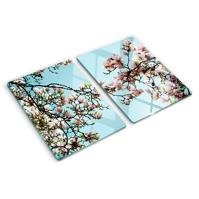 Glass cutting board Magnolia flowers on a blue background