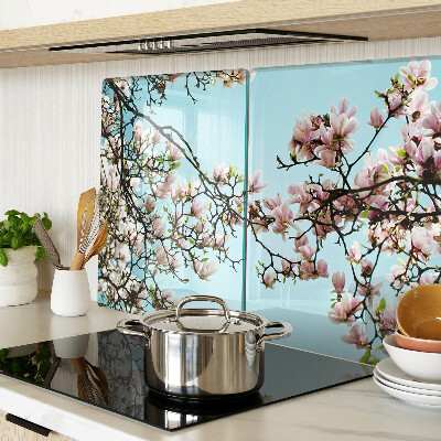 Glass cutting board Magnolia flowers on a blue background